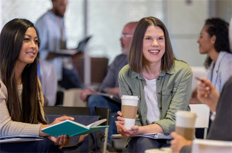 Smiling diverse people talking at a meeting